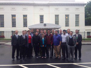 Hackathon participants standing outside the entrance to the West Wing