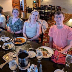 People at a table smiling for a photo