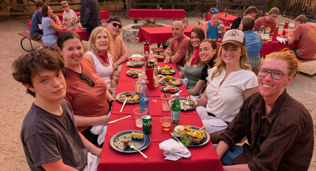 Buckeye Innovation team members sitting around a table enjoying a meal outdoors